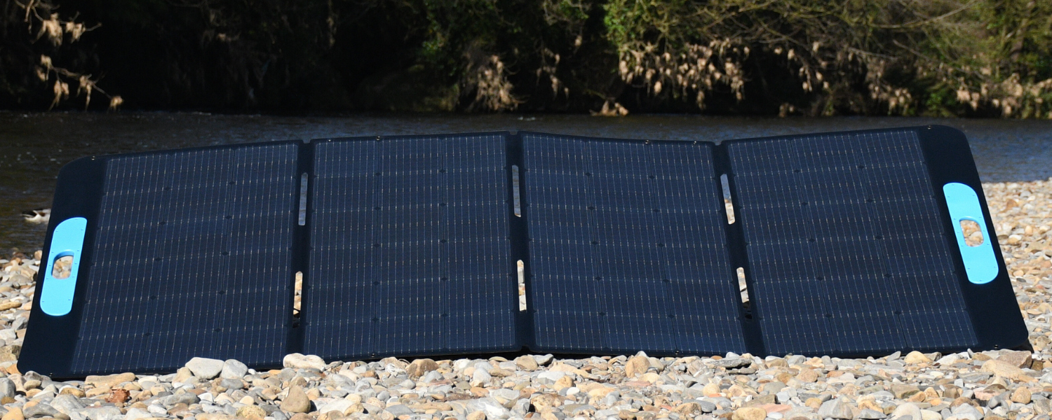 Totalsolar 400 on a cobbled shore next to a river