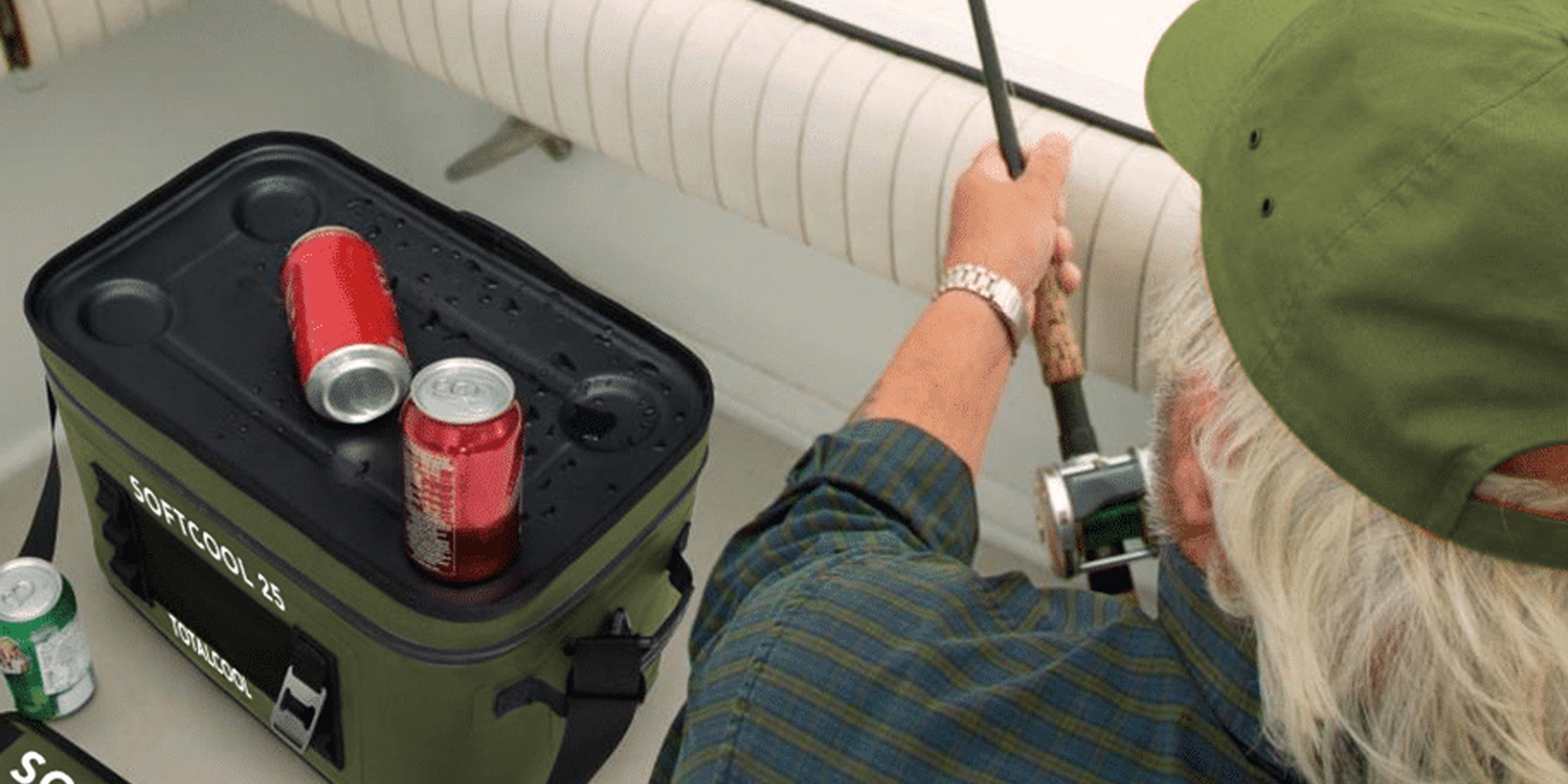 Image of an older man fishing on a boat with a softcool 25 for storing beverages