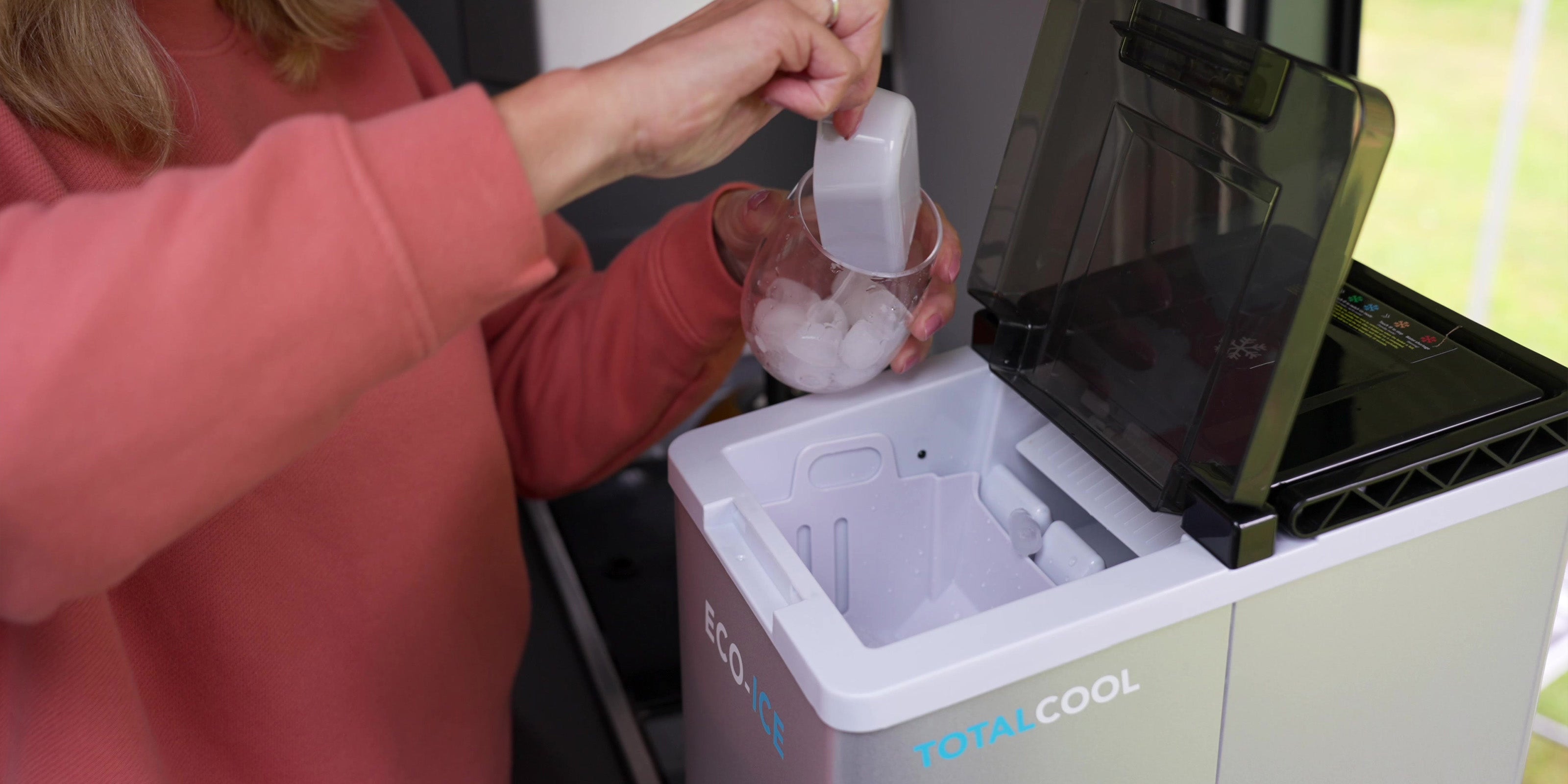 Image of someone using the ice created by the Eco-Ice ice machine