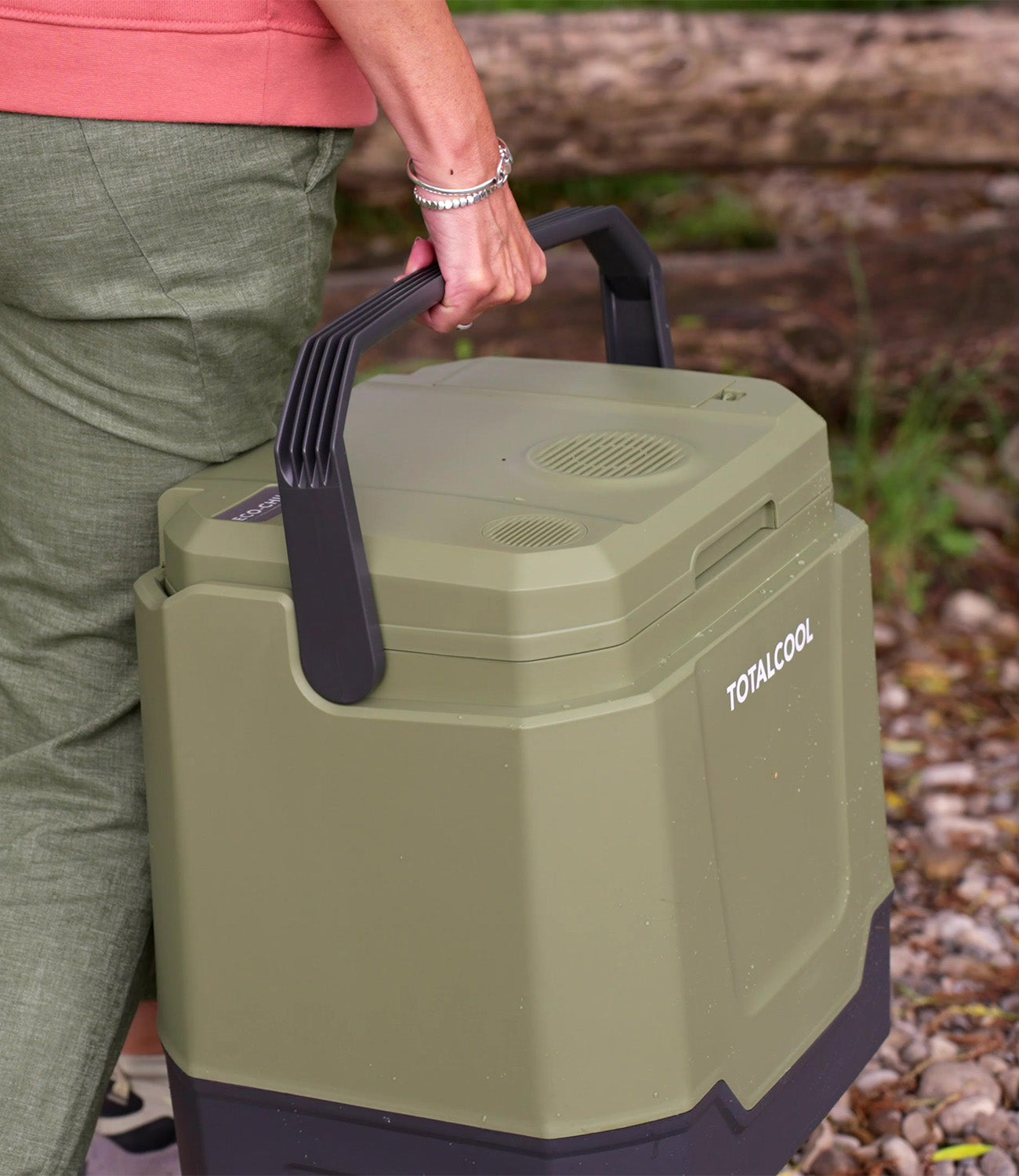 Image of the 12 volt Eco-chill 33 green coolbox being carried