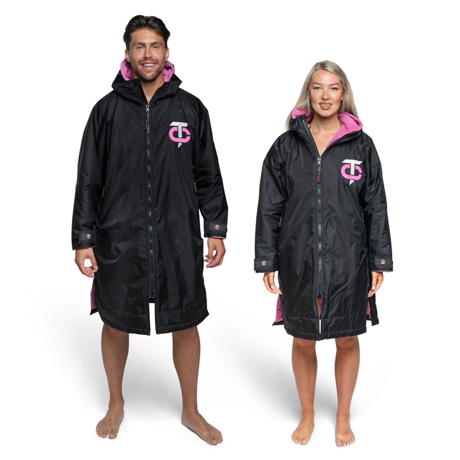 Front view of the black and pink T-Robe being worn by man and woman 